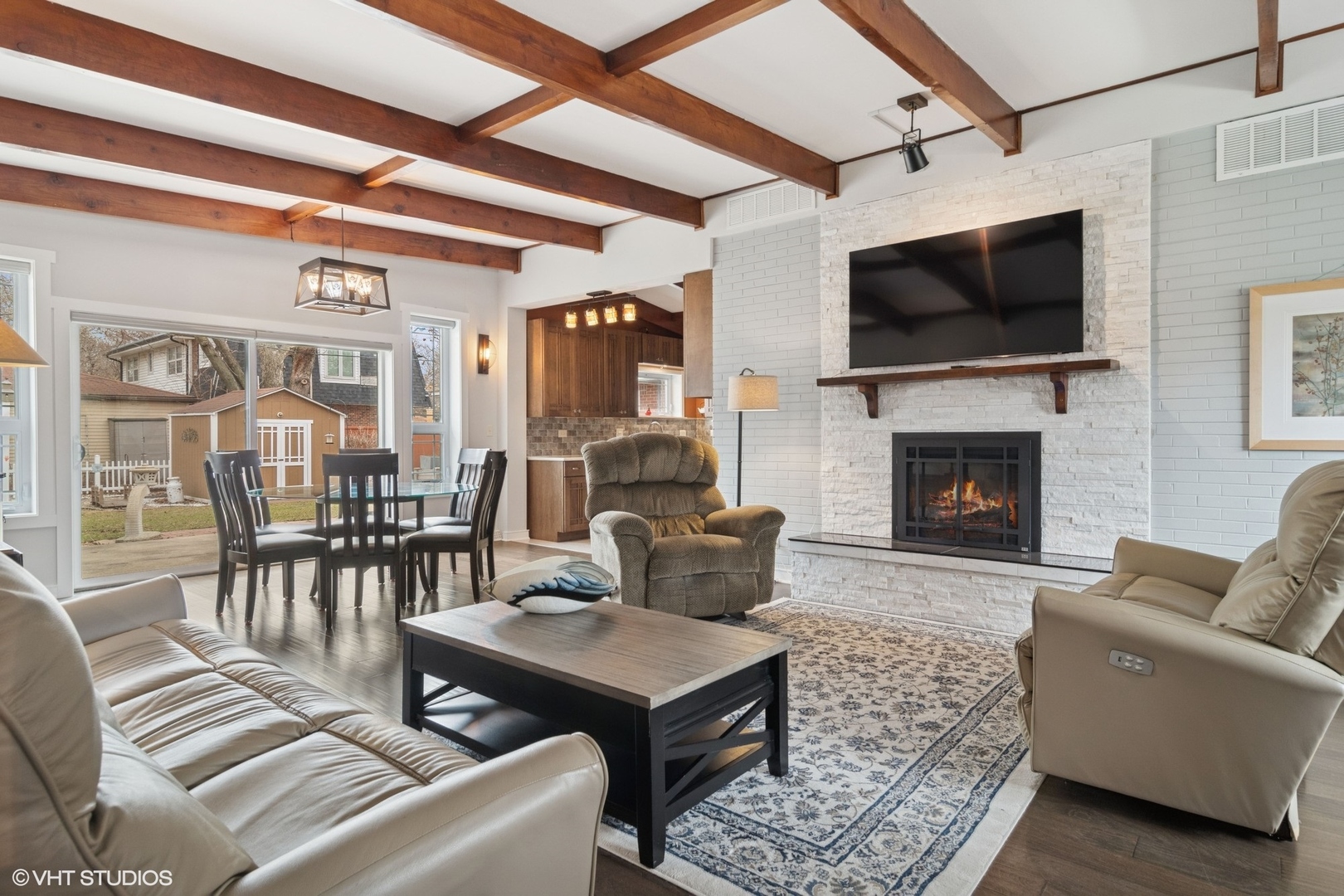 1505 Good Avenue Park Ridge, IL 60068 - Photo 3 of 19 a living room with furniture a flat screen tv and a fireplace