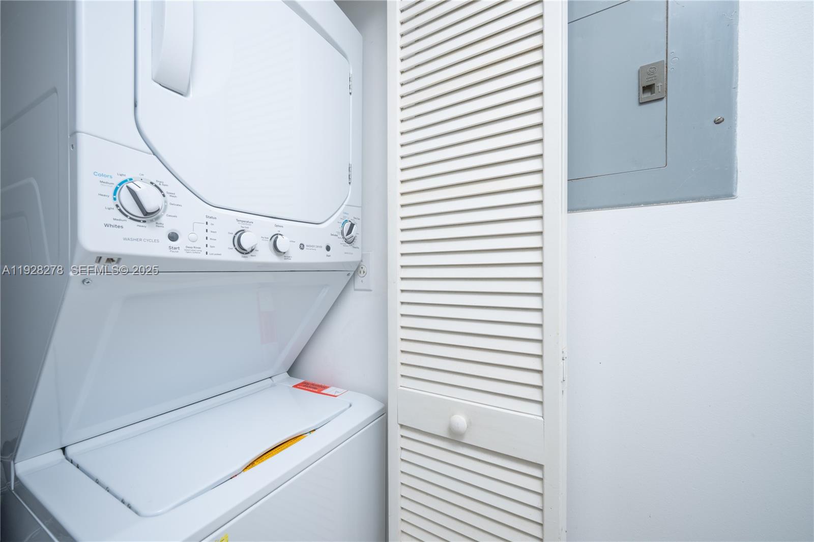 5900 Collins Avenue, Unit 906 Miami Beach, FL 33140 - Photo 12 of 49 a utility room with dryer and washer
