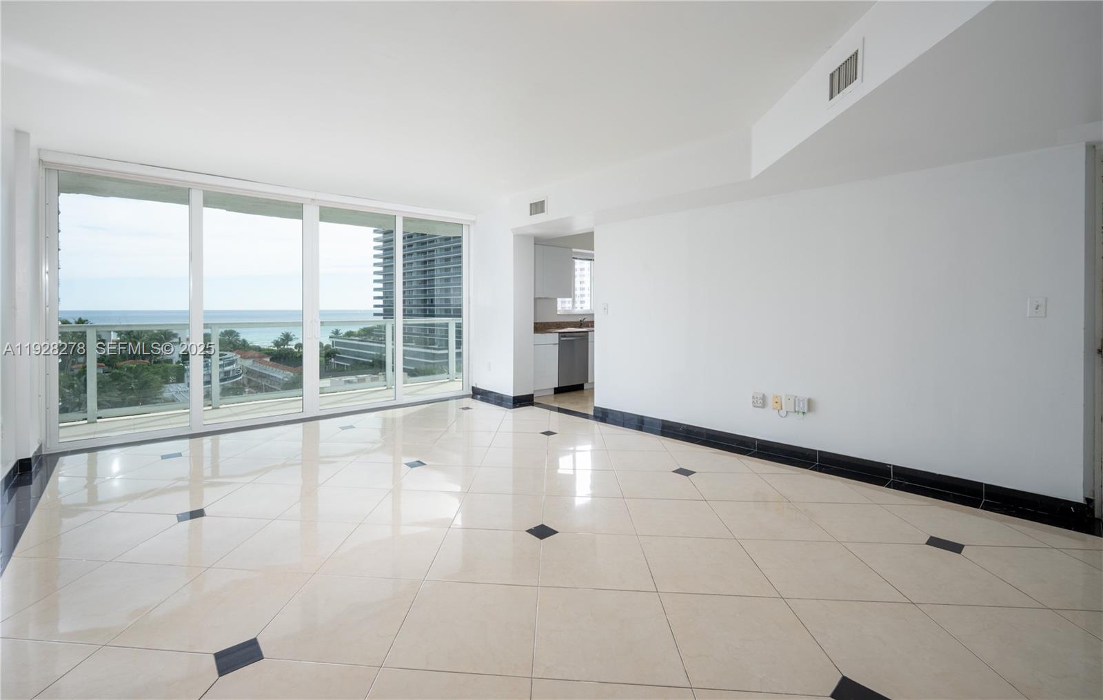 5900 Collins Avenue, Unit 906 Miami Beach, FL 33140 - Photo 15 of 49 a view of an empty room with a window