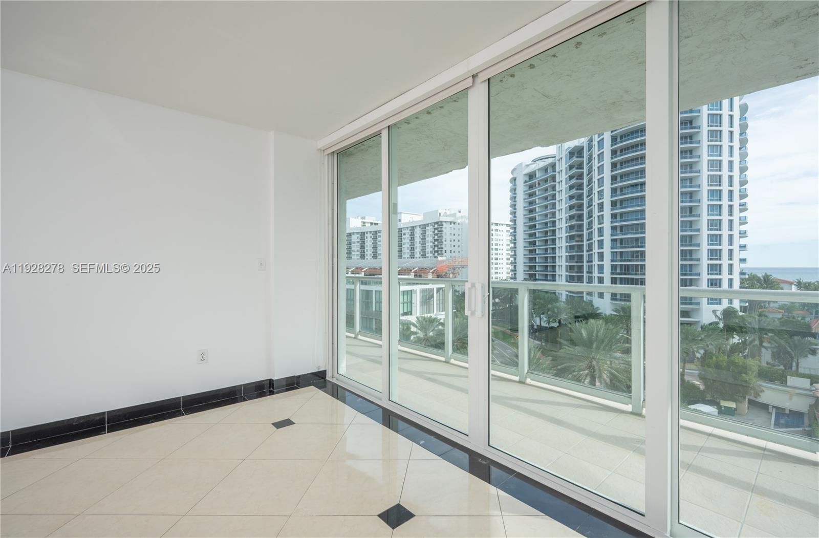 5900 Collins Avenue, Unit 906 Miami Beach, FL 33140 - Photo 16 of 49 a view of an empty room and window
