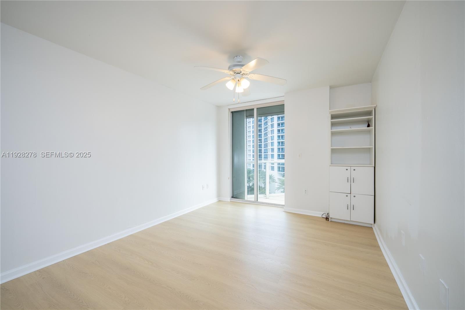 5900 Collins Avenue, Unit 906 Miami Beach, FL 33140 - Photo 22 of 49 wooden floor in an empty room with a window