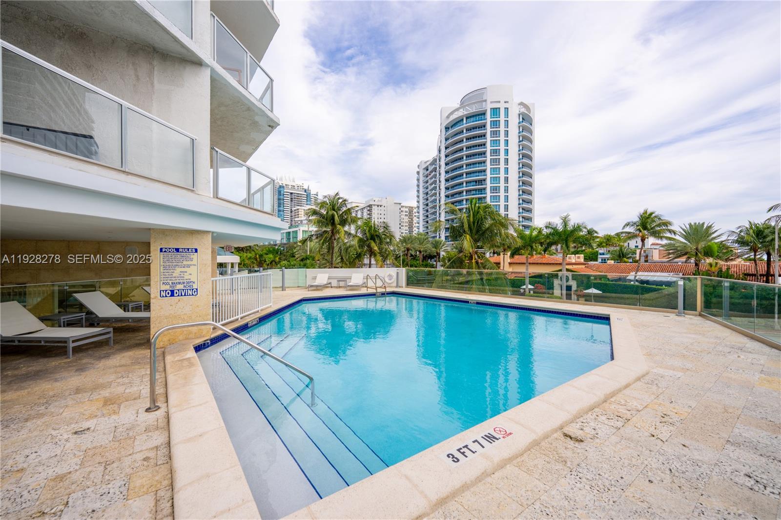 5900 Collins Avenue, Unit 906 Miami Beach, FL 33140 - Photo 32 of 49 a view of swimming pool from a terrace