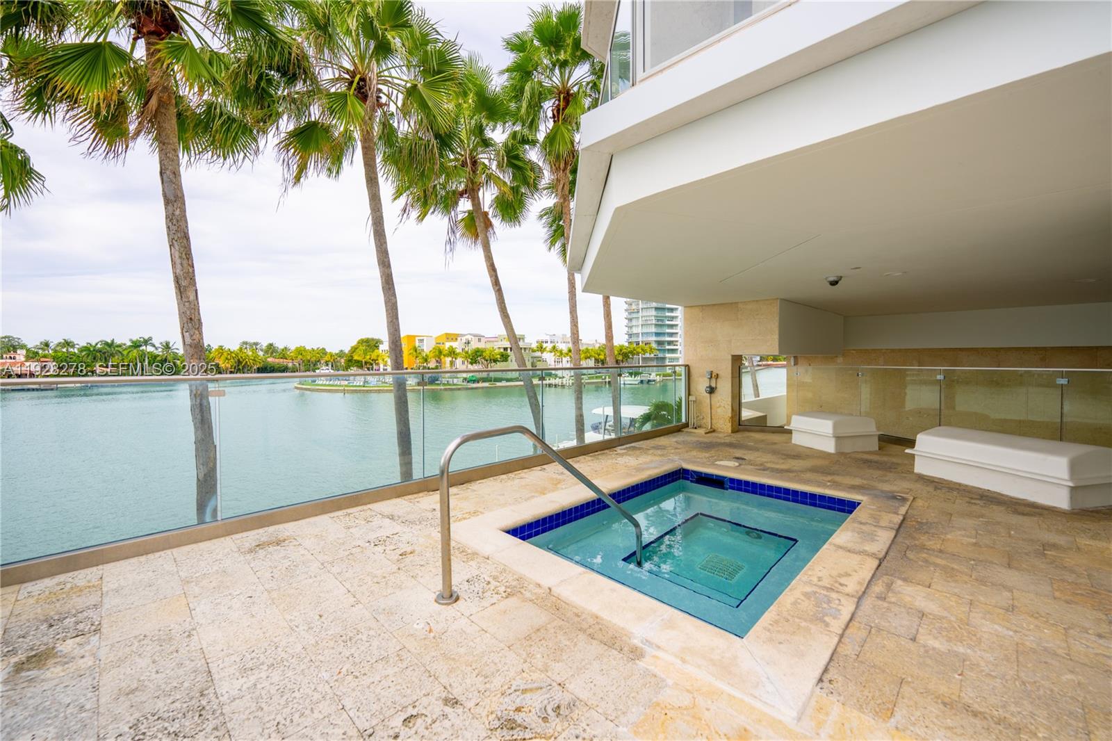 5900 Collins Avenue, Unit 906 Miami Beach, FL 33140 - Photo 35 of 49 a view of swimming pool with a lounge chairs