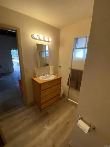 a view of an empty room with a fan