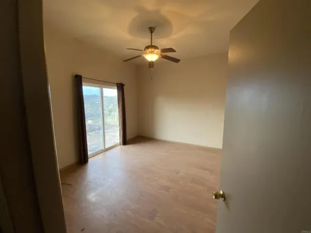 a bathroom with a shower and toilet