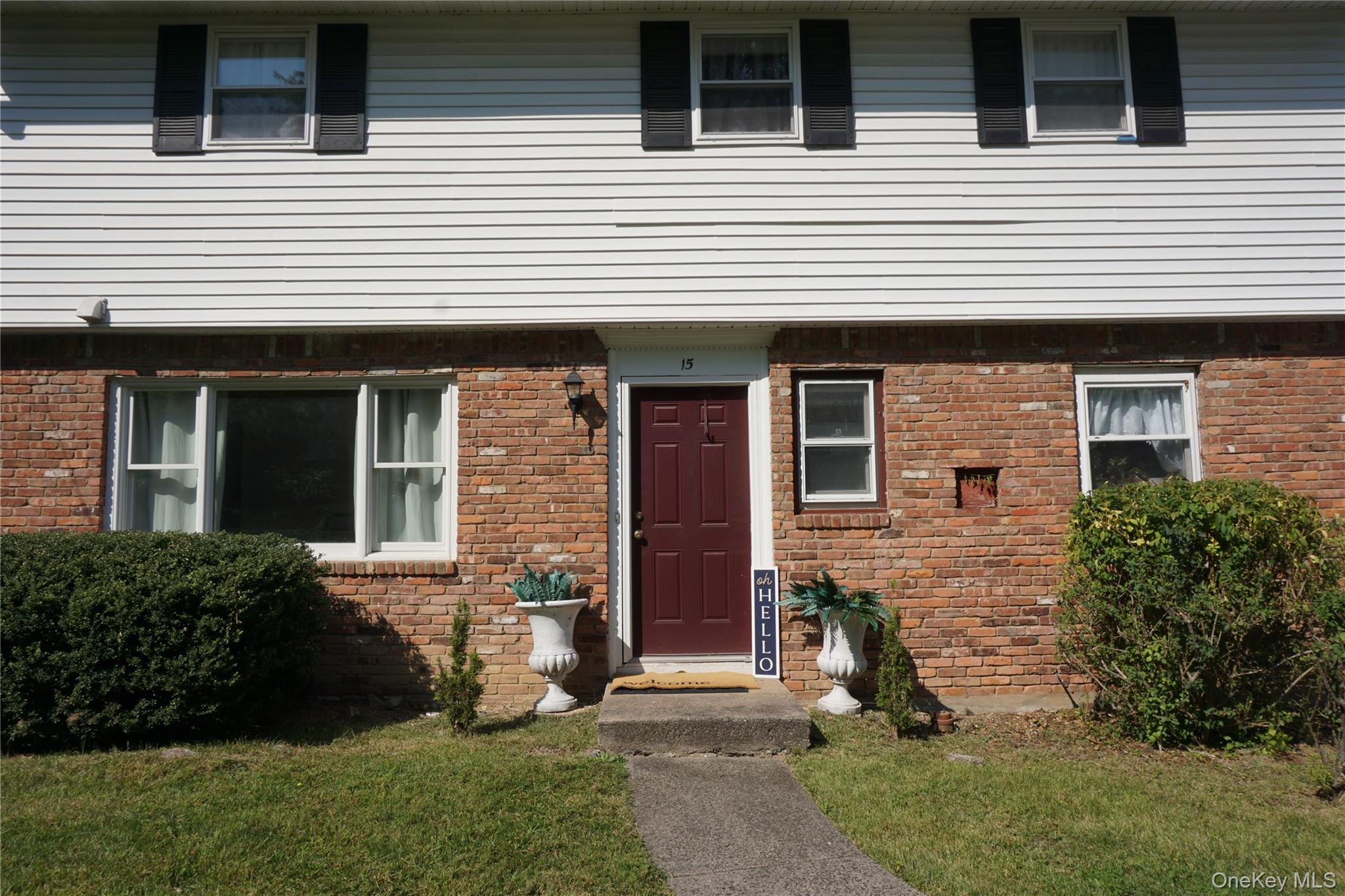 15 Greenridge Way Spring Valley, NY 10977 - Photo 17 of 17 View of front of property featuring a front yard and brick siding