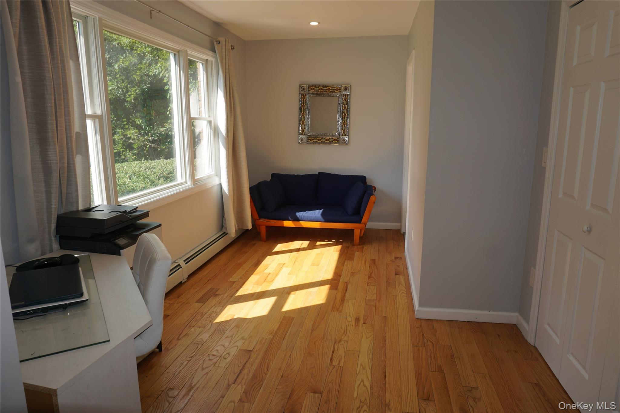15 Greenridge Way Spring Valley, NY 10977 - Photo 6 of 17 Living area with light wood-style floors, a baseboard radiator, and recessed lighting