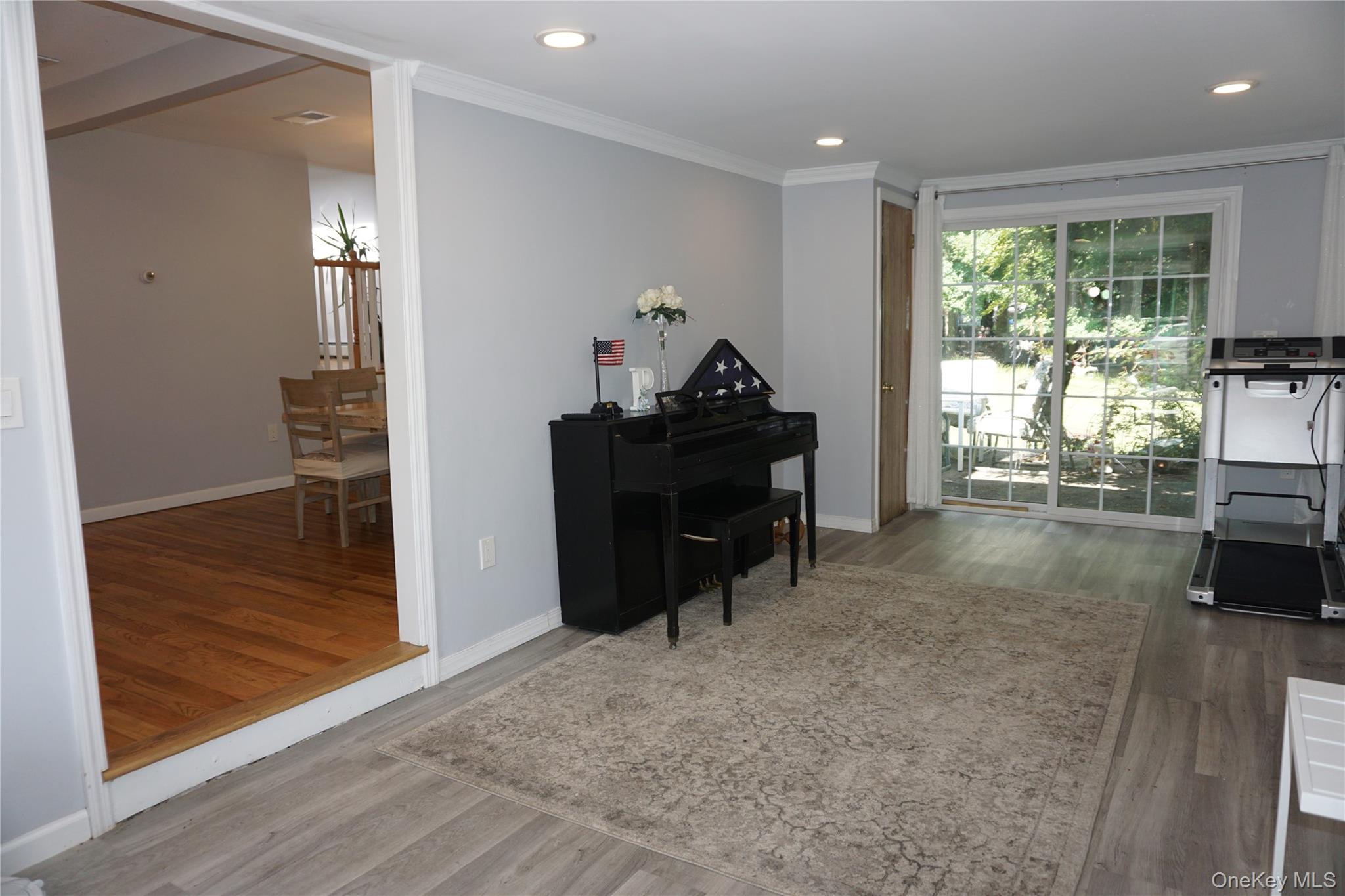 15 Greenridge Way Spring Valley, NY 10977 - Photo 8 of 17 Bonus room featuring dark wood-type flooring, crown molding, and recessed lighting