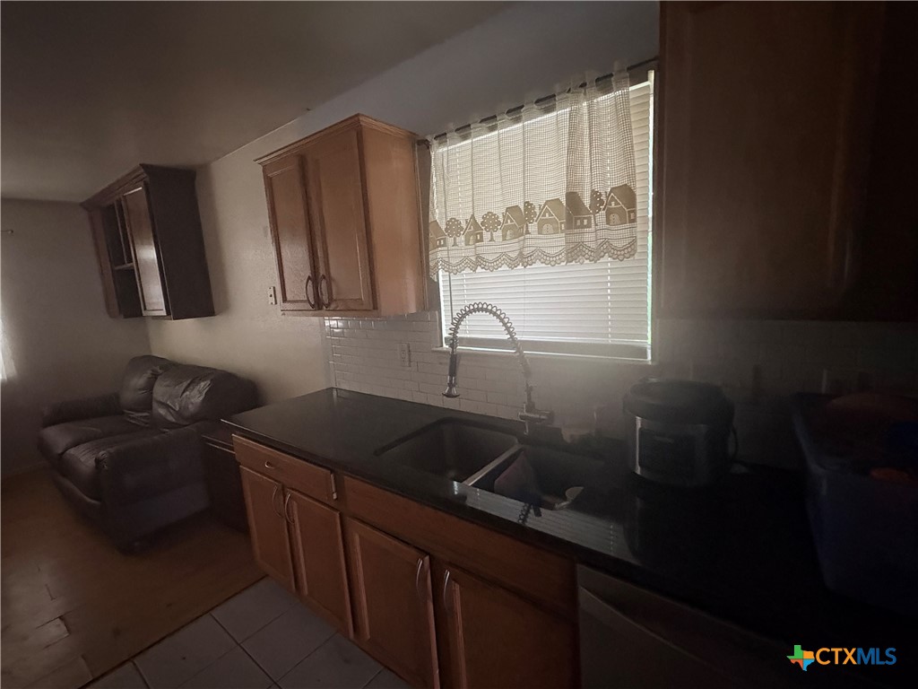 206 Timber Ridge Drive Nolanville, TX 76559 - Photo 7 of 21 a kitchen with a sink and cabinets