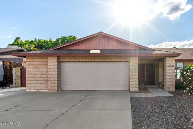 a front view of a house with a garage
