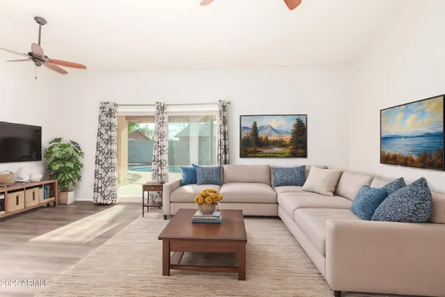 a living room with furniture and a flat screen tv