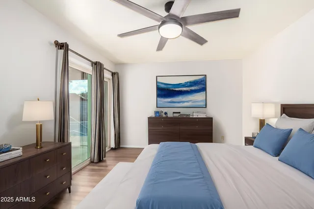 a bedroom with a bed and a dresser