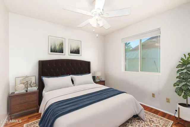 a bedroom with a large bed and a window