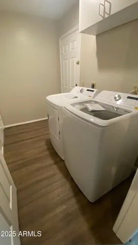 a utility room with washer and dryer