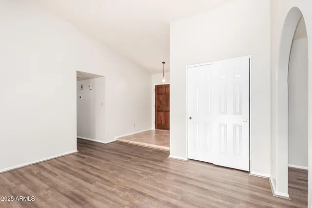 an empty room with wooden floor