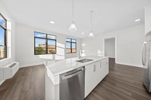 a kitchen with a stove and a sink