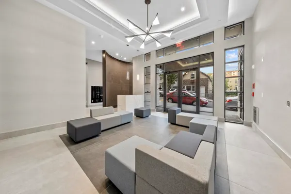 a view of hallway with livingroom and furniture