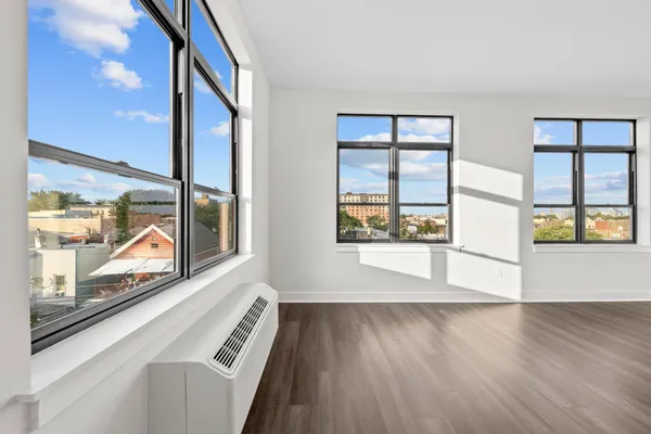 a view of an entryway with wooden floor