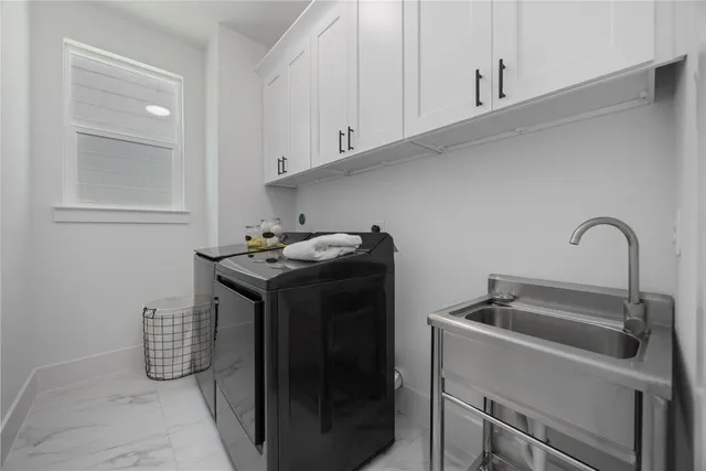 a kitchen with a sink and cabinets