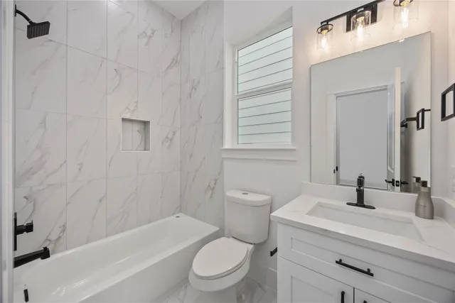 a bathroom with a sink a toilet and a bathtub