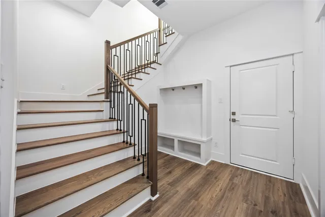 a view of entryway with wooden floor
