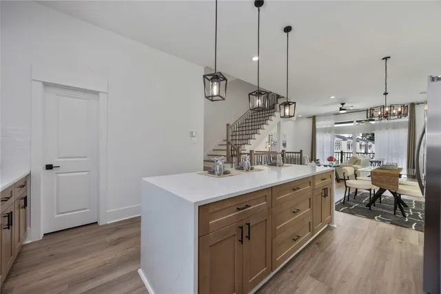 a kitchen with sink cabinets and wooden floor