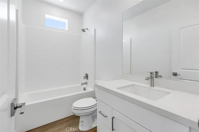 a bathroom with a sink a toilet and a bathtub