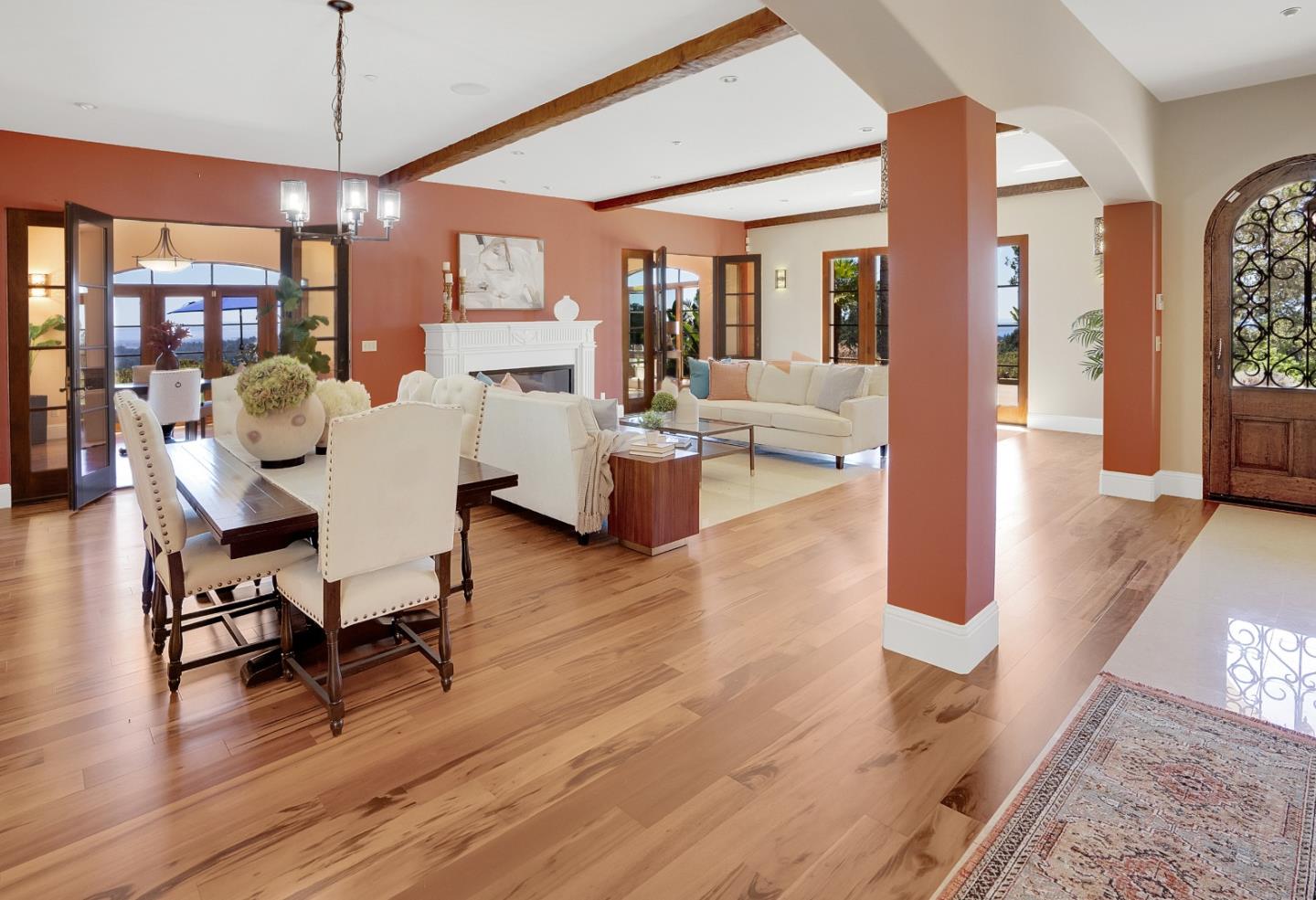 3030 Pleasant Valley Road Aptos, CA 95003 - Photo 11 of 70 a dining room with wooden floor a glass table and chairs