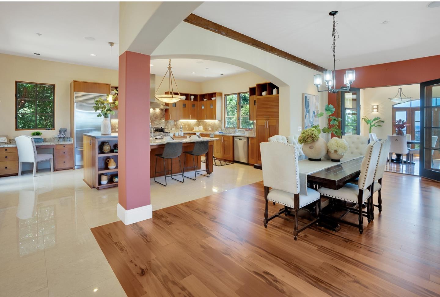 3030 Pleasant Valley Road Aptos, CA 95003 - Photo 12 of 70 a dining room with wooden floor a chandelier a glass table and chairs