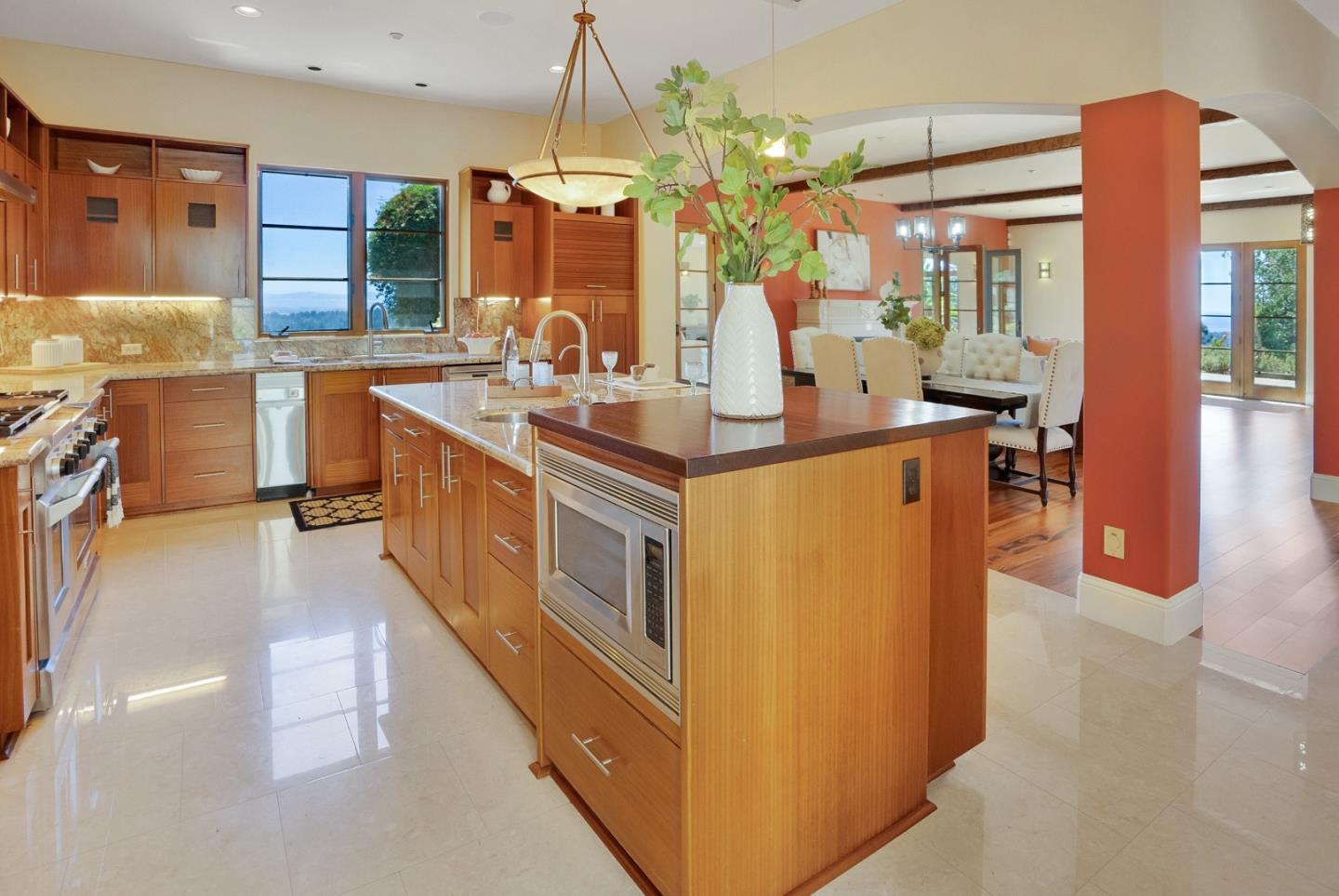 3030 Pleasant Valley Road Aptos, CA 95003 - Photo 17 of 70 a kitchen with stainless steel appliances granite countertop a stove a sink a refrigerator and a dining table with wooden floor