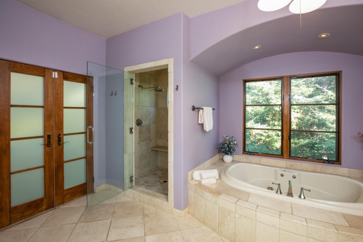 3030 Pleasant Valley Road Aptos, CA 95003 - Photo 28 of 70 a bathroom with a granite countertop sink a bathtub and next to a window