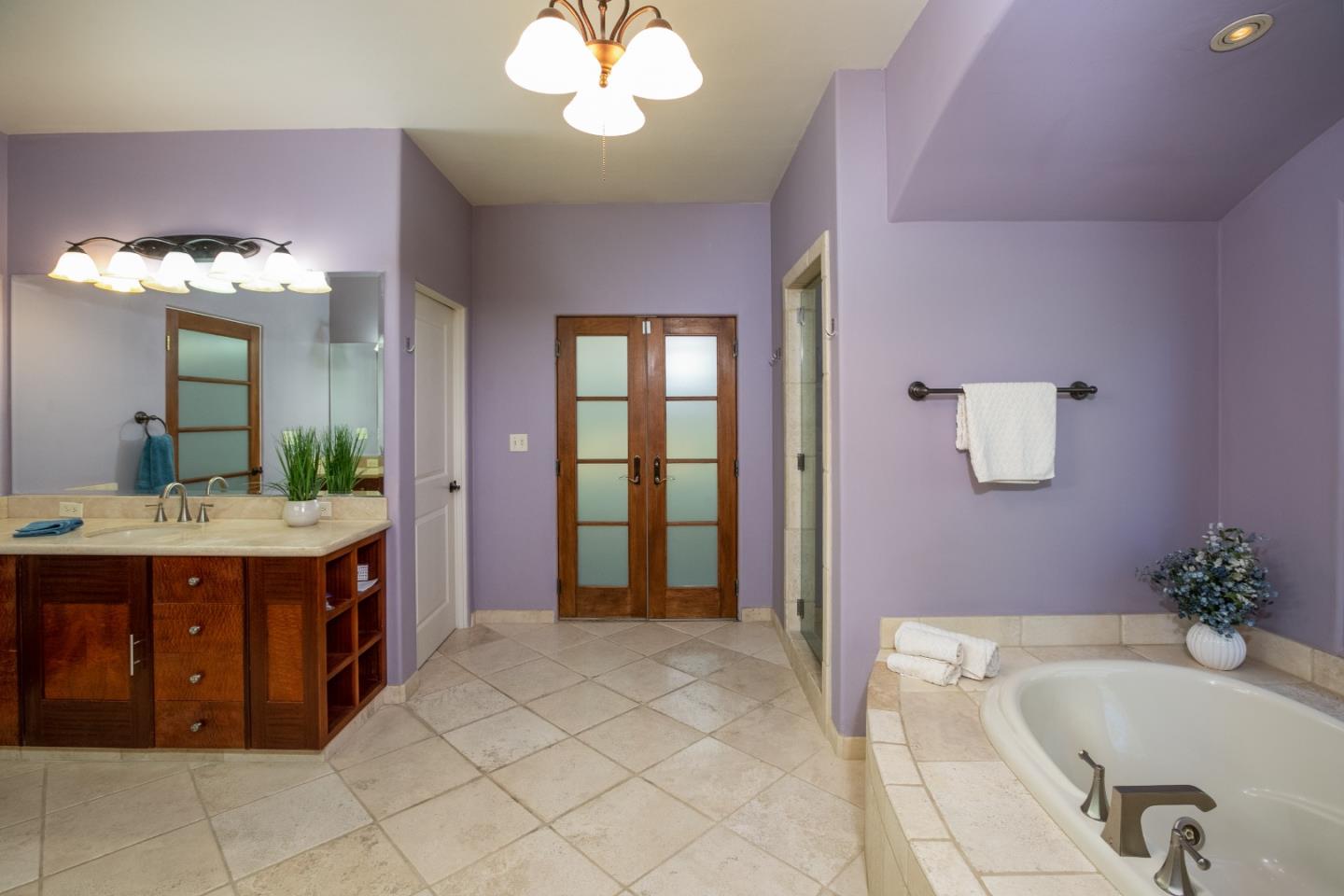 3030 Pleasant Valley Road Aptos, CA 95003 - Photo 29 of 70 a spacious bathroom with a granite countertop tub sink and mirror