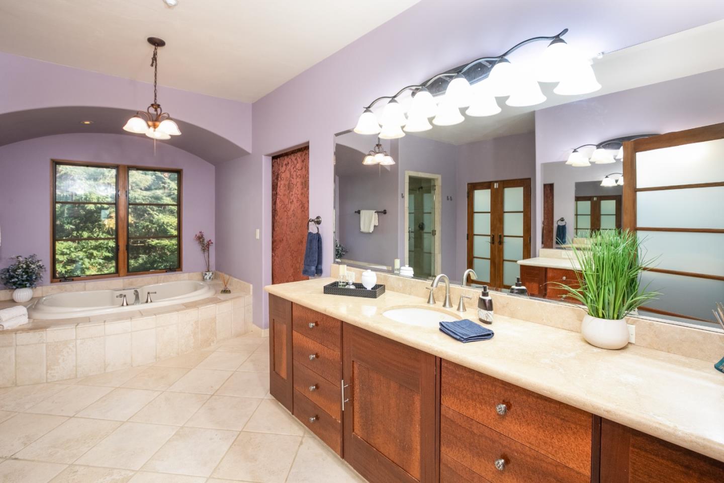 3030 Pleasant Valley Road Aptos, CA 95003 - Photo 33 of 70 a spacious bathroom with a tub sink and mirror