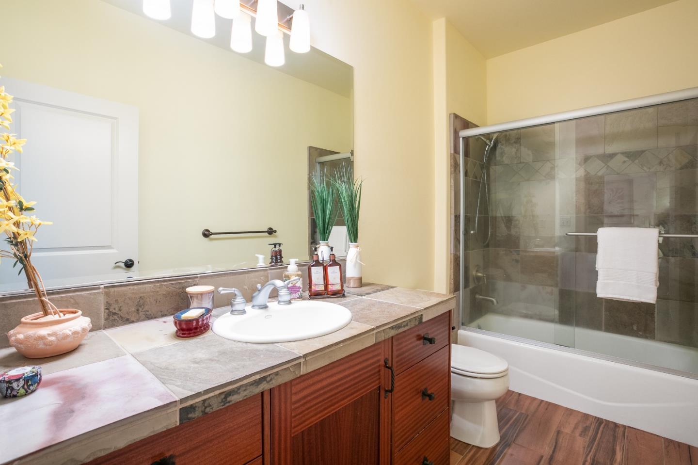 3030 Pleasant Valley Road Aptos, CA 95003 - Photo 40 of 70 a bathroom with a sink a toilet and shower