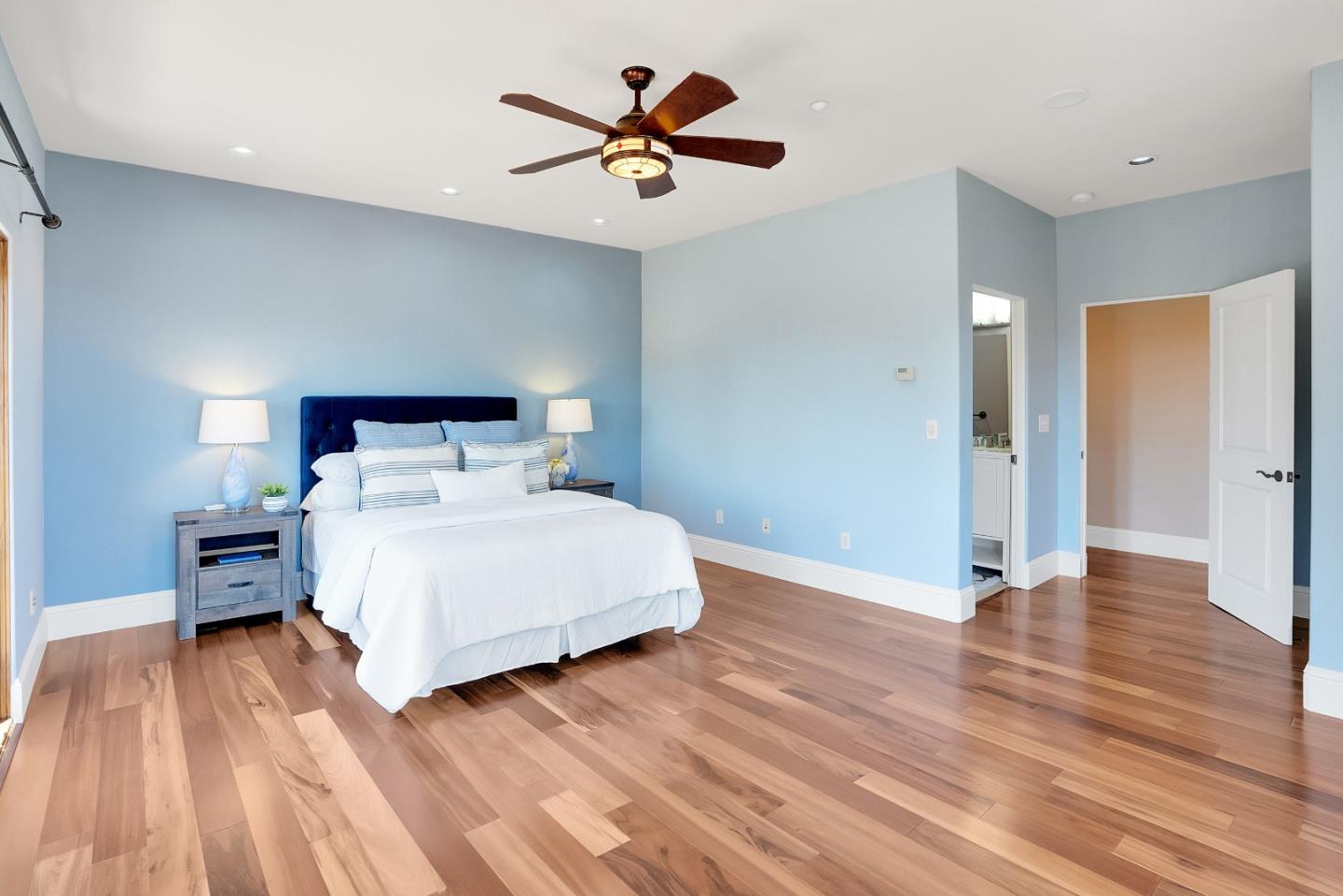 3030 Pleasant Valley Road Aptos, CA 95003 - Photo 46 of 70 a bedroom with a bed and a ceiling fan