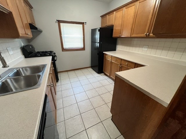 0 Lafayette Street, Unit 1 Fall River, MA 02723 - Photo 2 of 13 a kitchen with a sink a stove top oven a refrigerator and cabinets