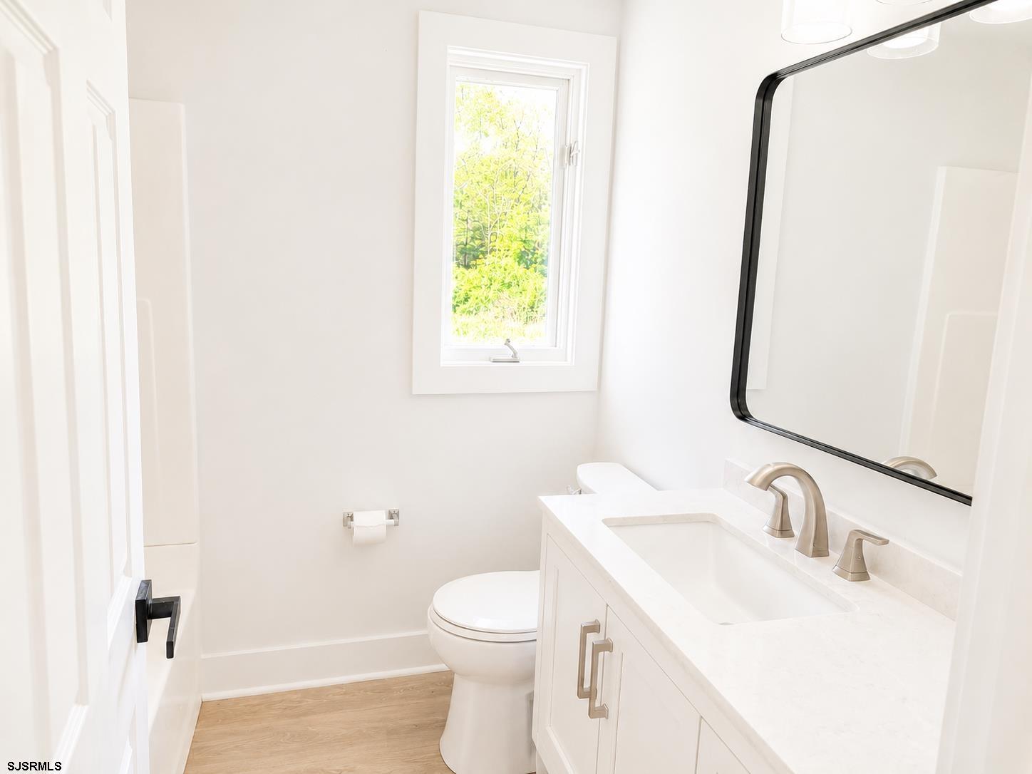 149 Old Port Republic Road Galloway Township, NJ 08205 - Photo 5 of 9 a bathroom with a sink toilet and mirror