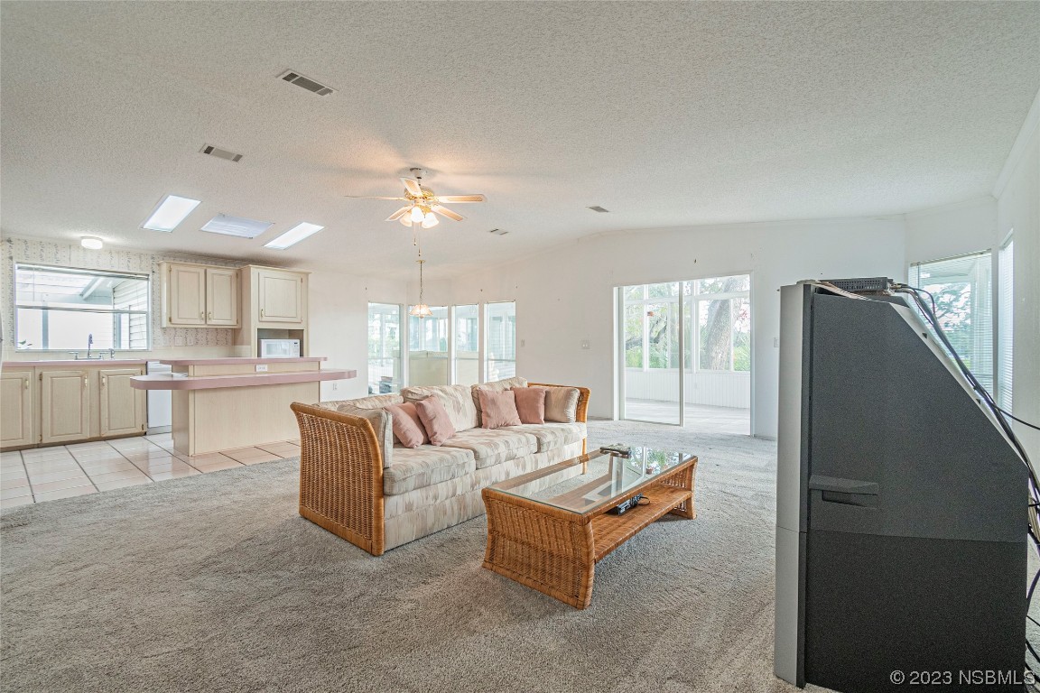 333 Schooner Avenue Edgewater, FL 32141 - Photo 13 of 31 a living room with furniture and a table