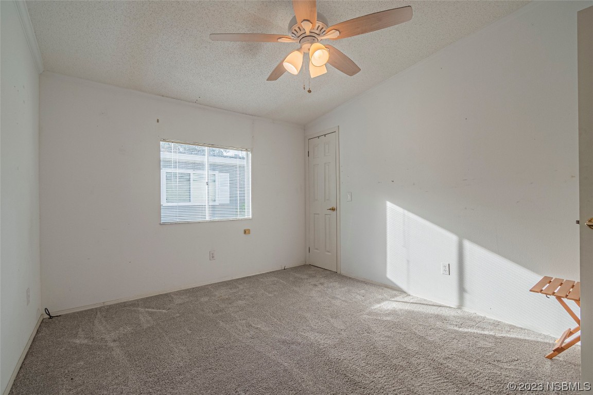 333 Schooner Avenue Edgewater, FL 32141 - Photo 18 of 31 a view of an empty room with a window