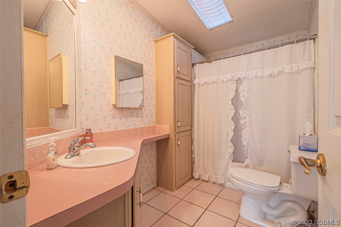 333 Schooner Avenue Edgewater, FL 32141 - Photo 19 of 31 a bathroom with a sink toilet and shower
