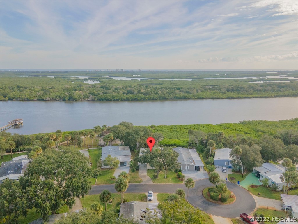 333 Schooner Avenue Edgewater, FL 32141 - Photo 6 of 31 an aerial view of lake and residential houses with outdoor space