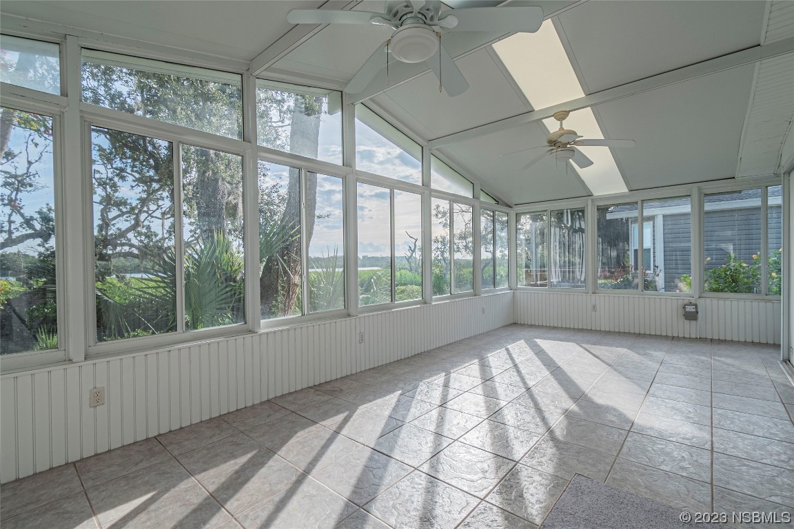 333 Schooner Avenue Edgewater, FL 32141 - Photo 9 of 31 a view of an empty room with windows