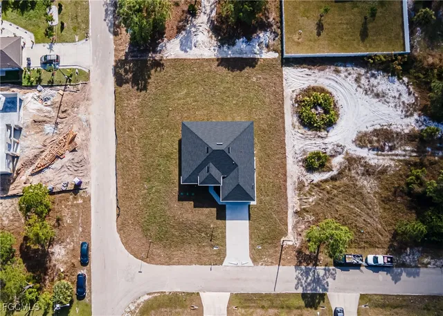 a aerial view of a house with yard