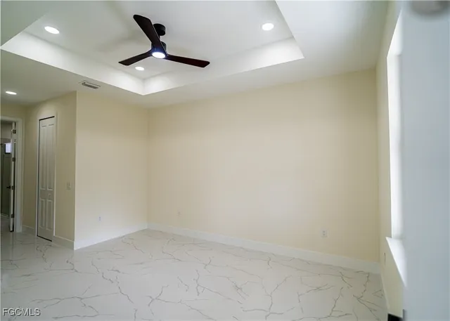 a view of room with a ceiling fan