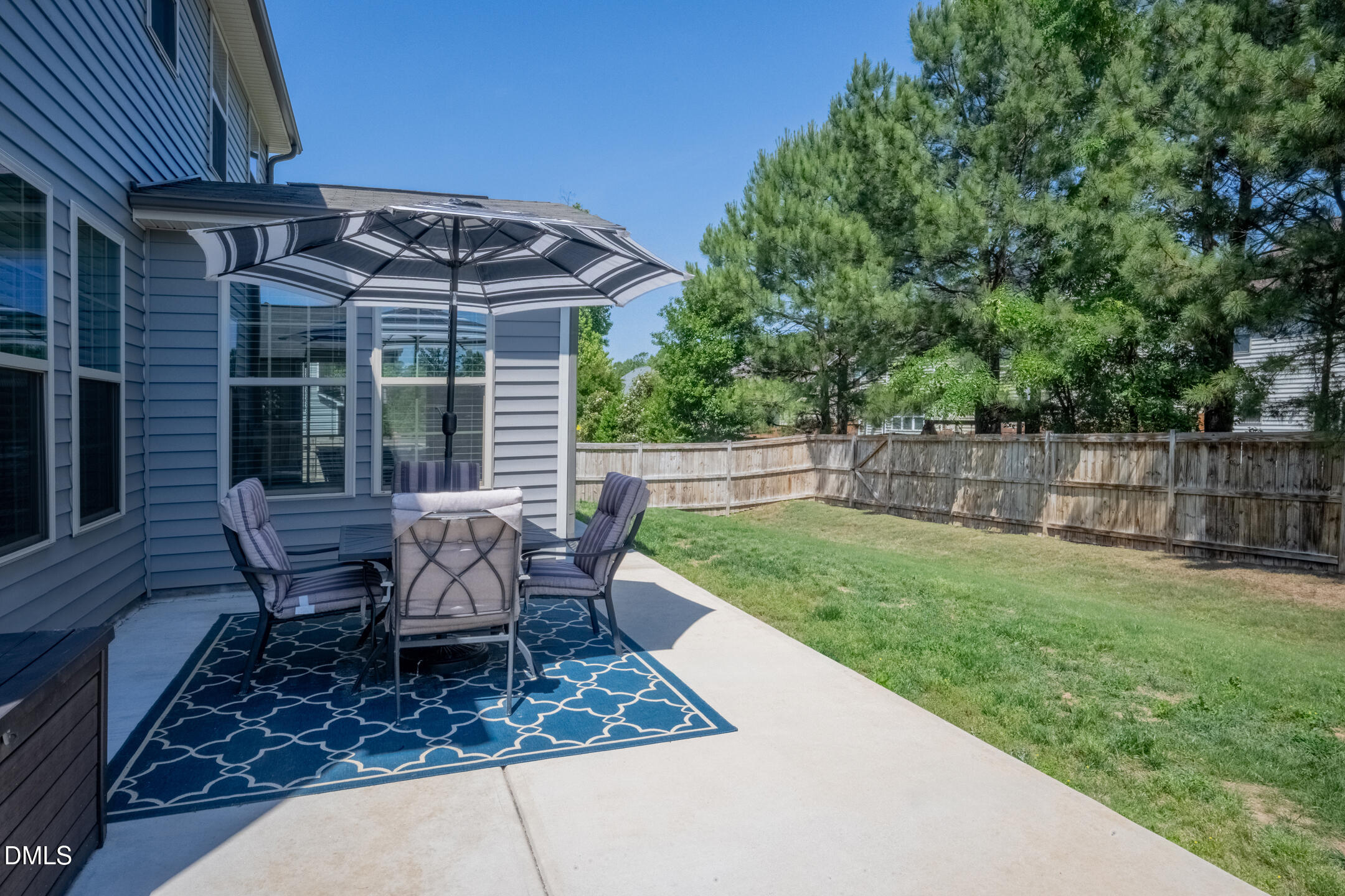 3541 Fairstone Road Wake Forest, NC 27587 - Photo 29 of 39 a view of a chair and table in backyard of the house