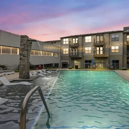 a view of a swimming pool with a yard
