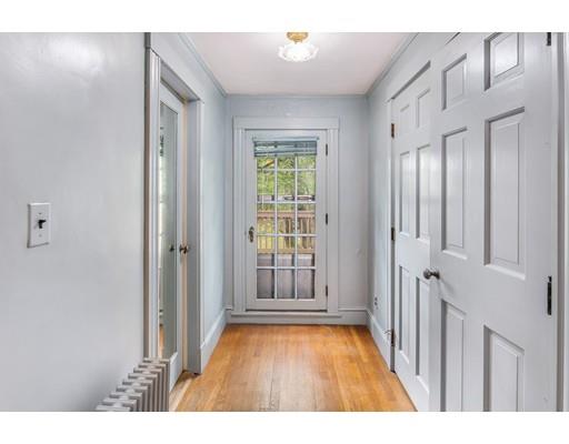 95 Leland Road Boston, MA 02467 - Photo 13 of 20 a view interior of a house with wooden floor and windows