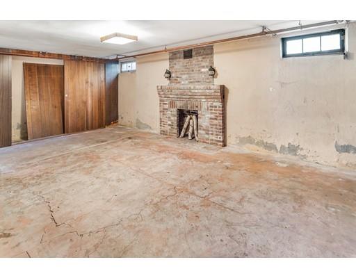 95 Leland Road Boston, MA 02467 - Photo 17 of 20 a view of livingroom with furniture and a fireplace