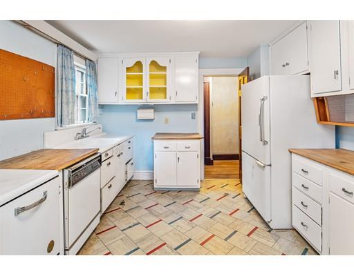 95 Leland Road Boston, MA 02467 - Photo 3 of 20 a kitchen with a stove a refrigerator and a stove
