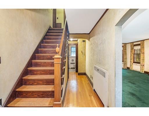 95 Leland Road Boston, MA 02467 - Photo 5 of 20 a view of a hallway with wooden floor and entryway